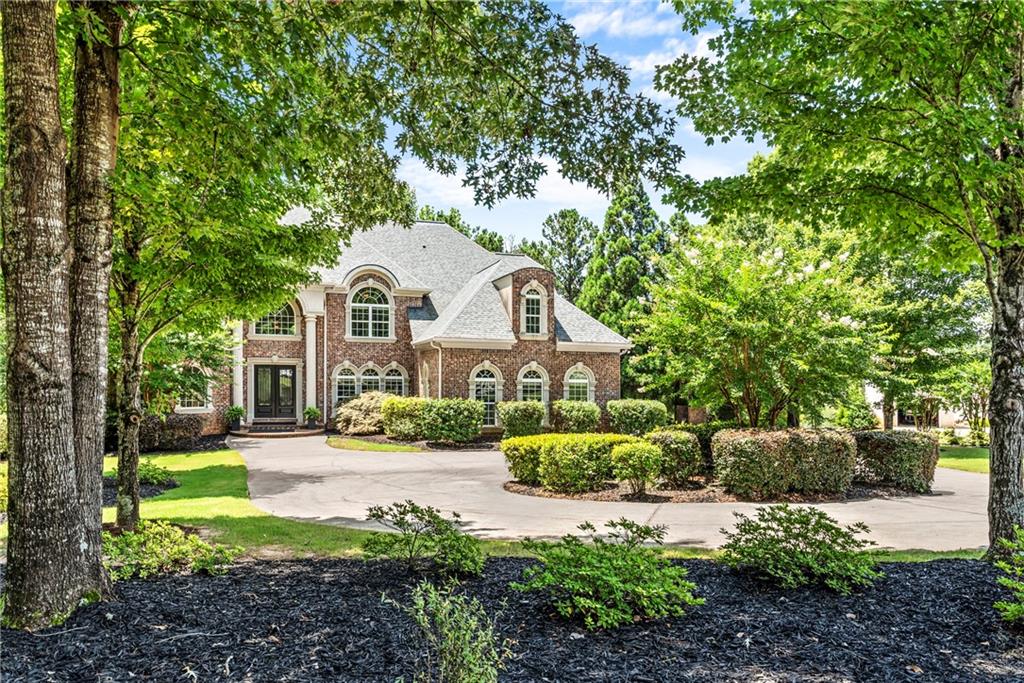 55 Moray Place Covington, GA 30014 - Photo 1 of 1 a front view of a house with a yard