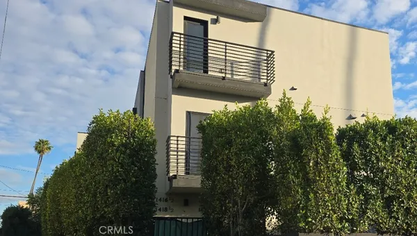 a view of a house with a tree