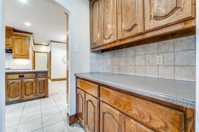 a kitchen with stainless steel appliances granite countertop a stove refrigerator and a sink