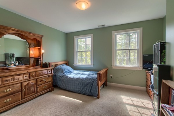 2 Otters Way Sterling, MA 01564 - Photo 16 of 30 a bedroom with a bed and a flat tv screen on the dresser
