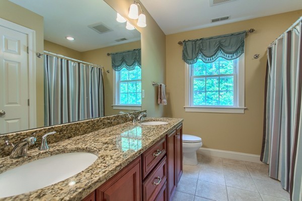2 Otters Way Sterling, MA 01564 - Photo 20 of 30 a bathroom with a granite countertop sink and a mirror