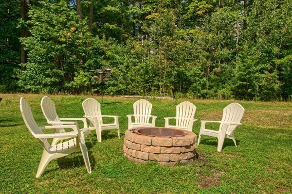 2 Otters Way Sterling, MA 01564 - Photo 25 of 30 a table and chairs in a garden