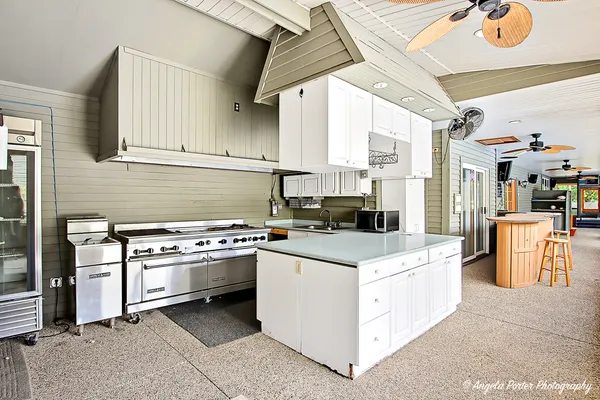 a view of house with yard and entertaining space