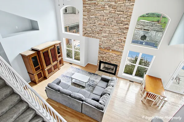 a kitchen with stainless steel appliances granite countertop a refrigerator a sink a stove a microwave and cabinets
