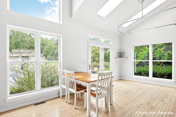 a dining room with furniture and window