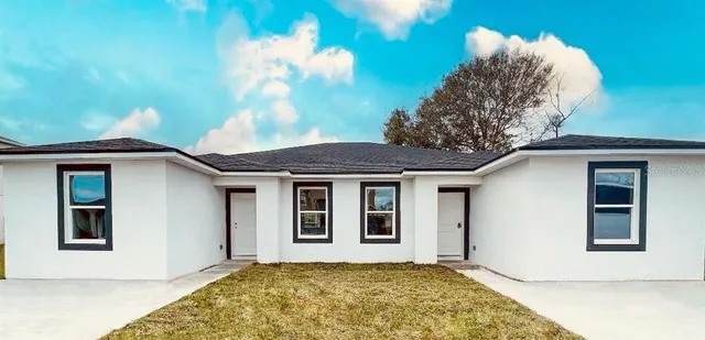 a house with a tree in front of it