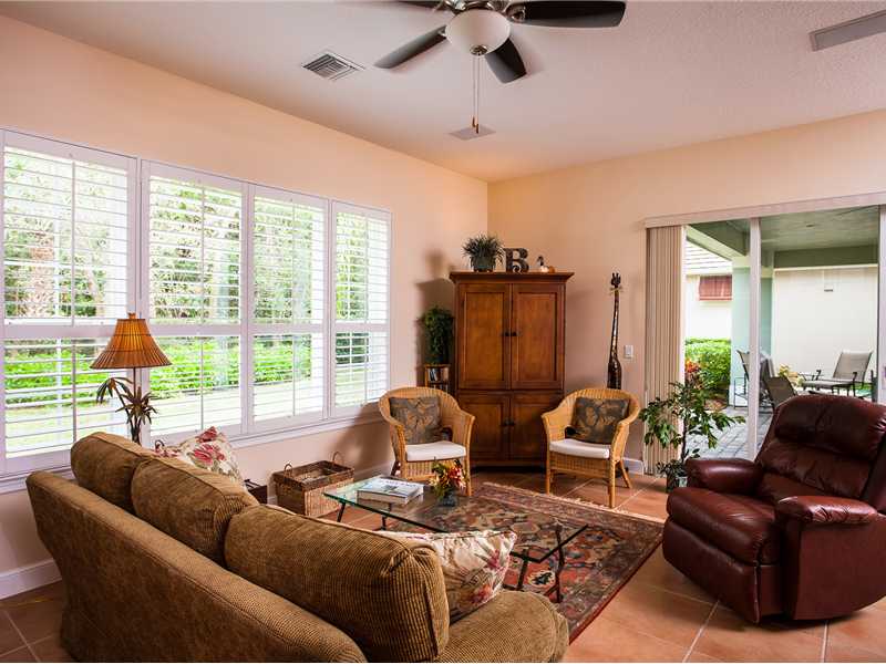 9120 Spring Time Drive Vero Beach, FL 32963 - Photo 12 of 17 a living room with furniture and a large window