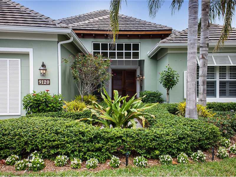 9120 Spring Time Drive Vero Beach, FL 32963 - Photo 17 of 17 a front view of a house with plants