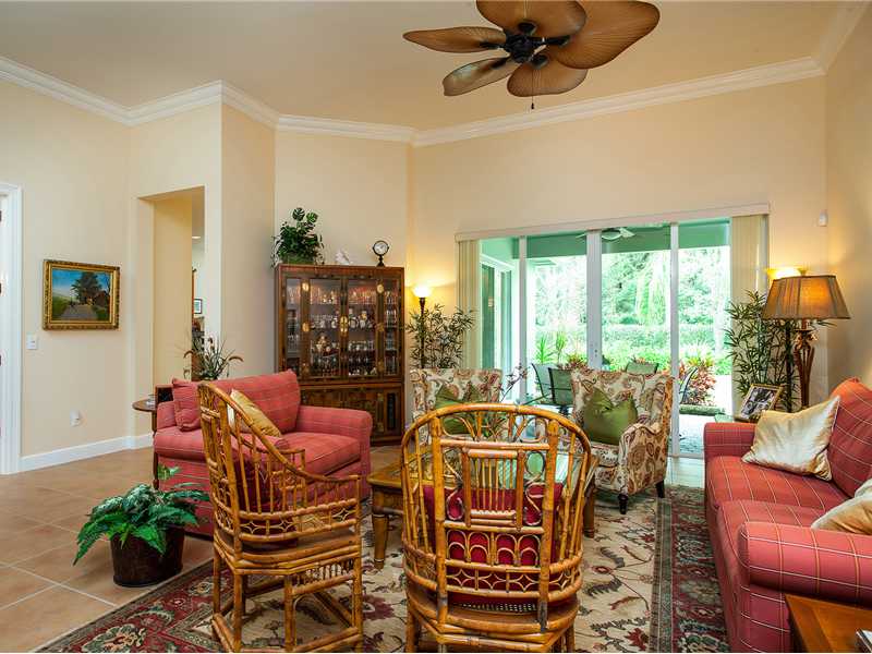 9120 Spring Time Drive Vero Beach, FL 32963 - Photo 3 of 17 a living room with patio furniture and a floor to ceiling window