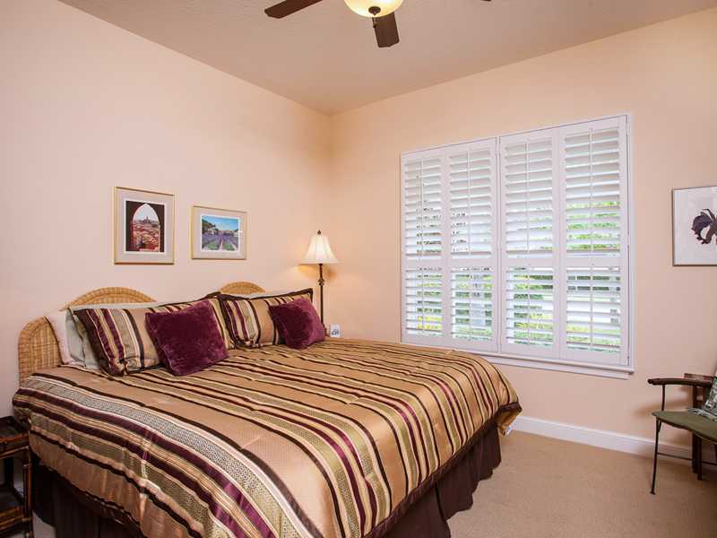 9120 Spring Time Drive Vero Beach, FL 32963 - Photo 7 of 17 a bedroom with a bed and a large window