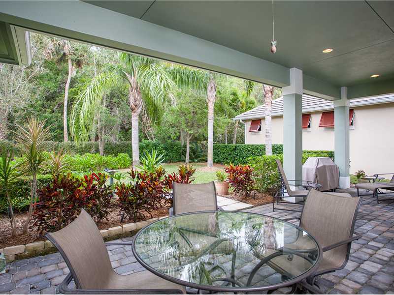 9120 Spring Time Drive Vero Beach, FL 32963 - Photo 8 of 17 a living room with patio furniture and potted plants