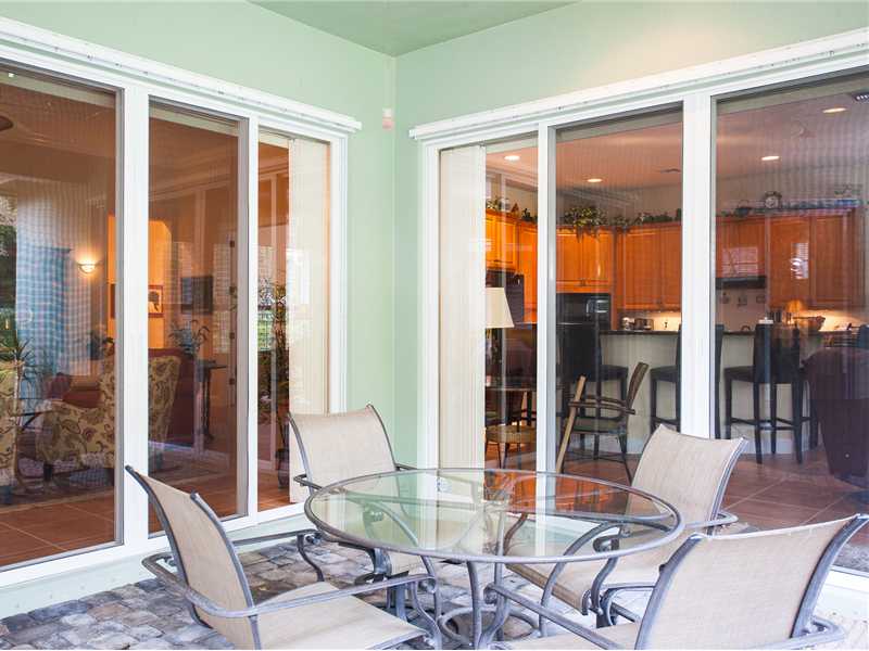 9120 Spring Time Drive Vero Beach, FL 32963 - Photo 10 of 17 a dining room with furniture window and wooden floor