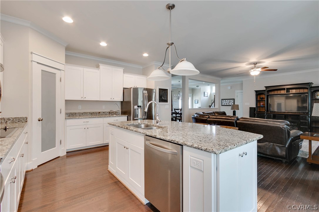 3237 Barkham Drive Midlothian, VA 23112 - Photo 13 of 48 a kitchen with stainless steel appliances granite countertop a sink a stove and a refrigerator
