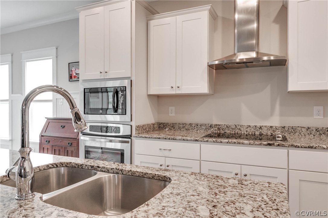 3237 Barkham Drive Midlothian, VA 23112 - Photo 14 of 48 a kitchen with granite countertop a sink a stove and cabinets