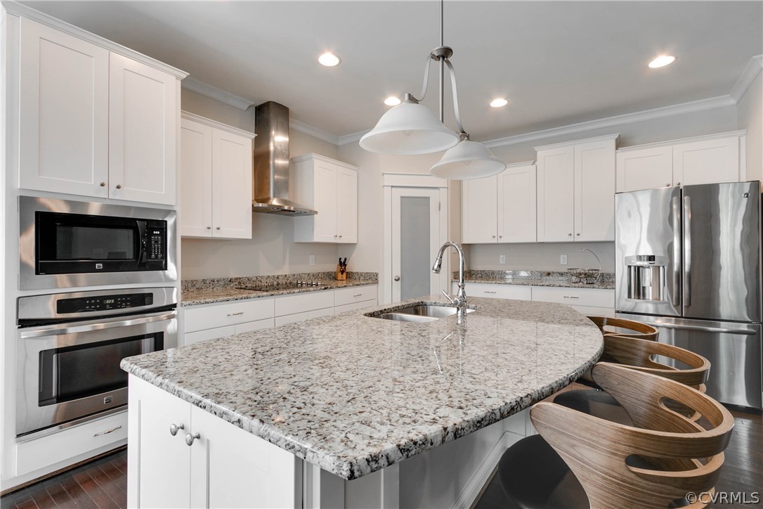 3237 Barkham Drive Midlothian, VA 23112 - Photo 15 of 48 a kitchen with stainless steel appliances granite countertop a sink a stove and a refrigerator