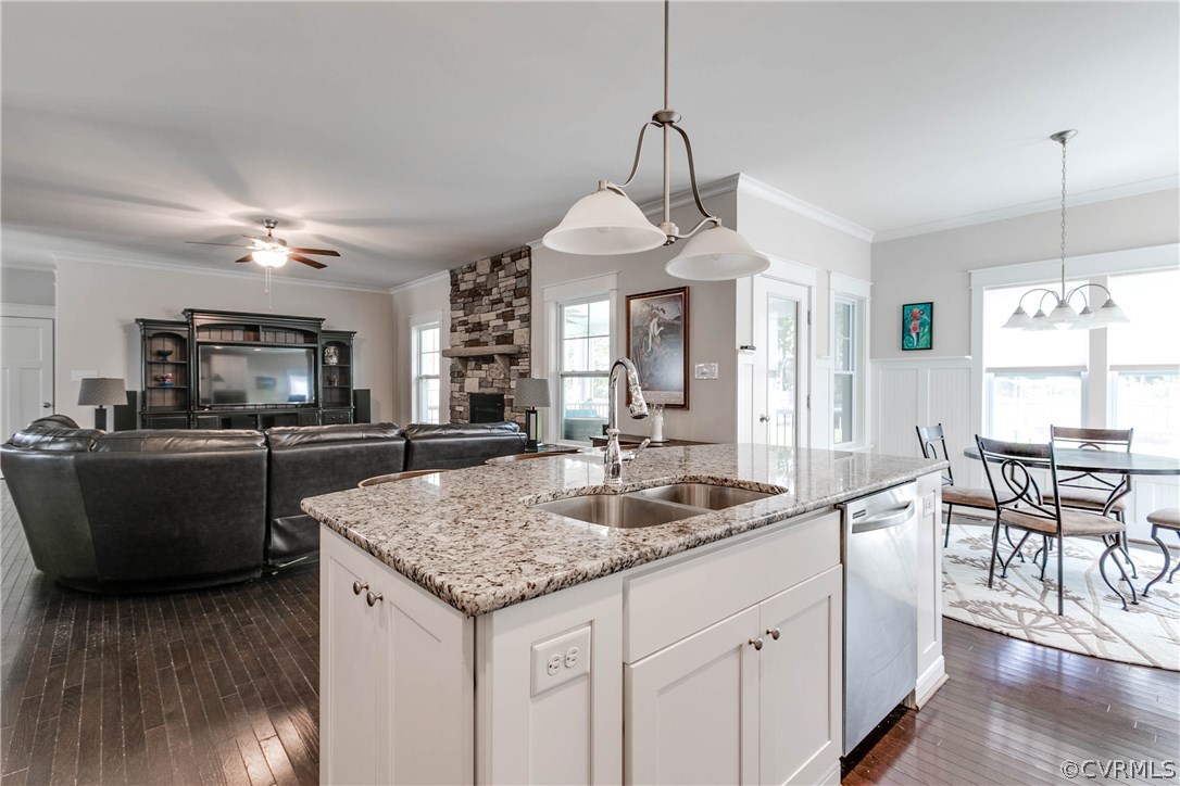 3237 Barkham Drive Midlothian, VA 23112 - Photo 17 of 48 a kitchen with a center island wooden floor and a chandelier
