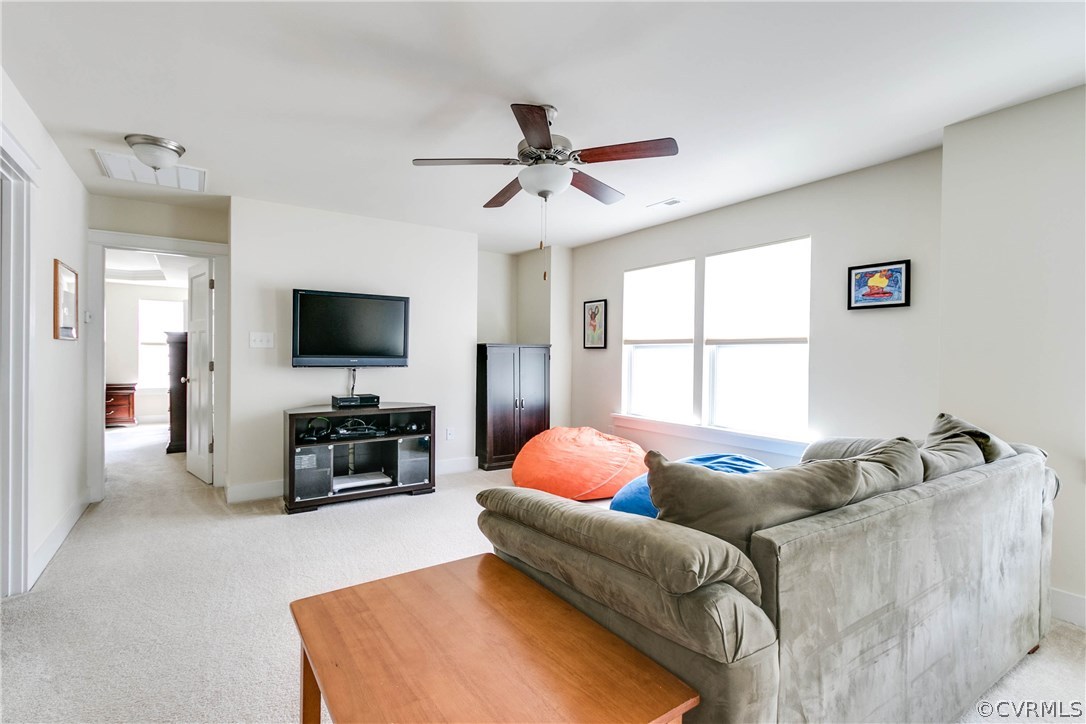 3237 Barkham Drive Midlothian, VA 23112 - Photo 23 of 48 a living room with furniture and a flat screen tv