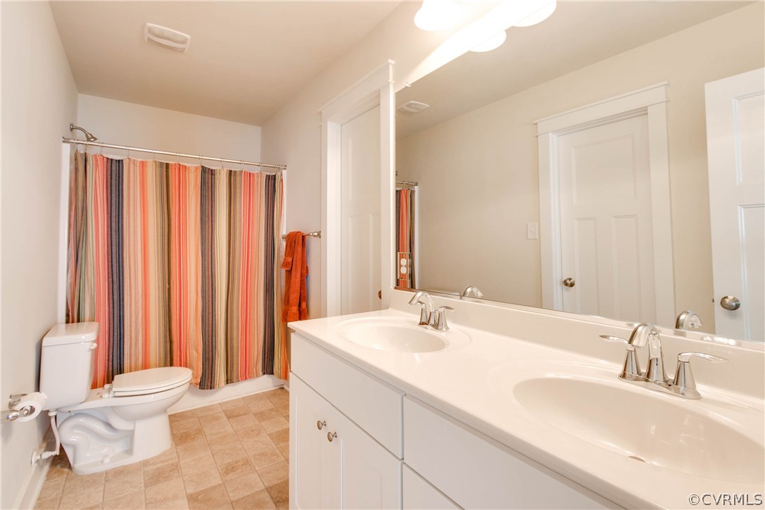 3237 Barkham Drive Midlothian, VA 23112 - Photo 27 of 48 a bathroom with a sink and a mirror