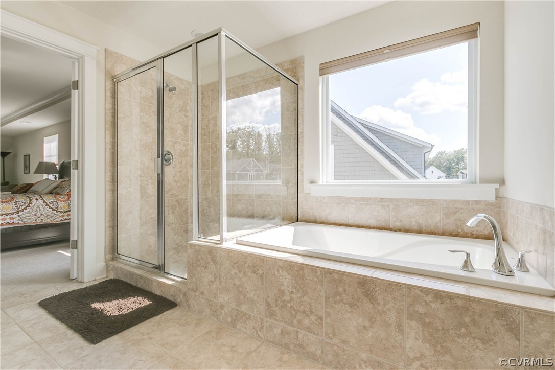 3237 Barkham Drive Midlothian, VA 23112 - Photo 35 of 48 a bathroom with a tub and a shower
