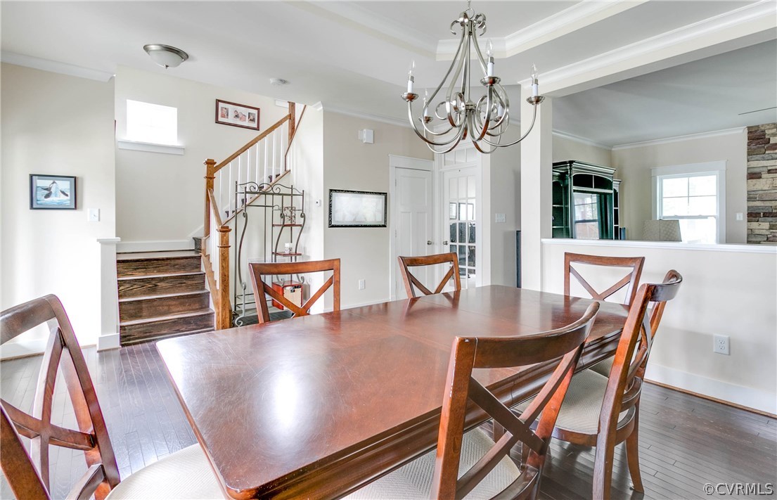 3237 Barkham Drive Midlothian, VA 23112 - Photo 7 of 48 a view of a dining room with furniture wooden floor and chandelier