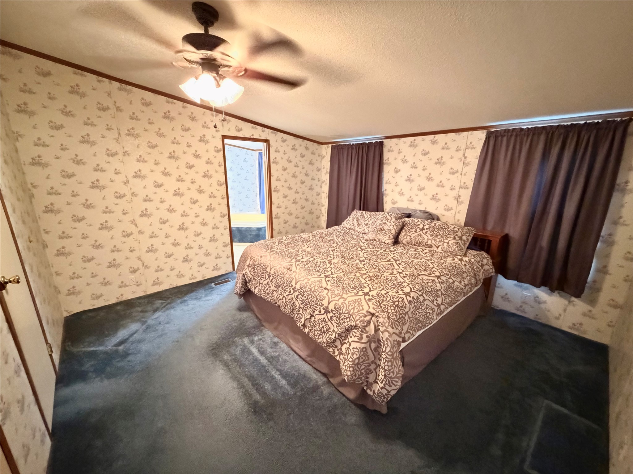 153 Prairie Lea Drive Angleton, TX 77515 - Photo 21 of 30 a bedroom with a bed dresser and a window