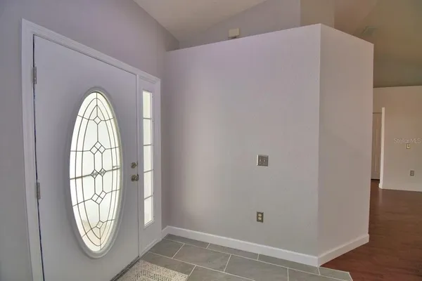 a view of front door with wooden floor