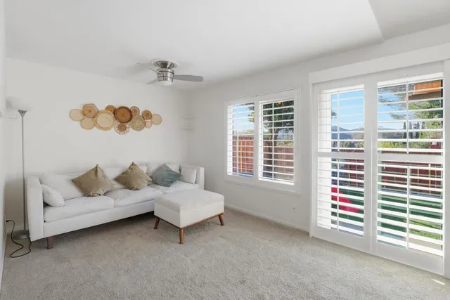 a living room with furniture and window