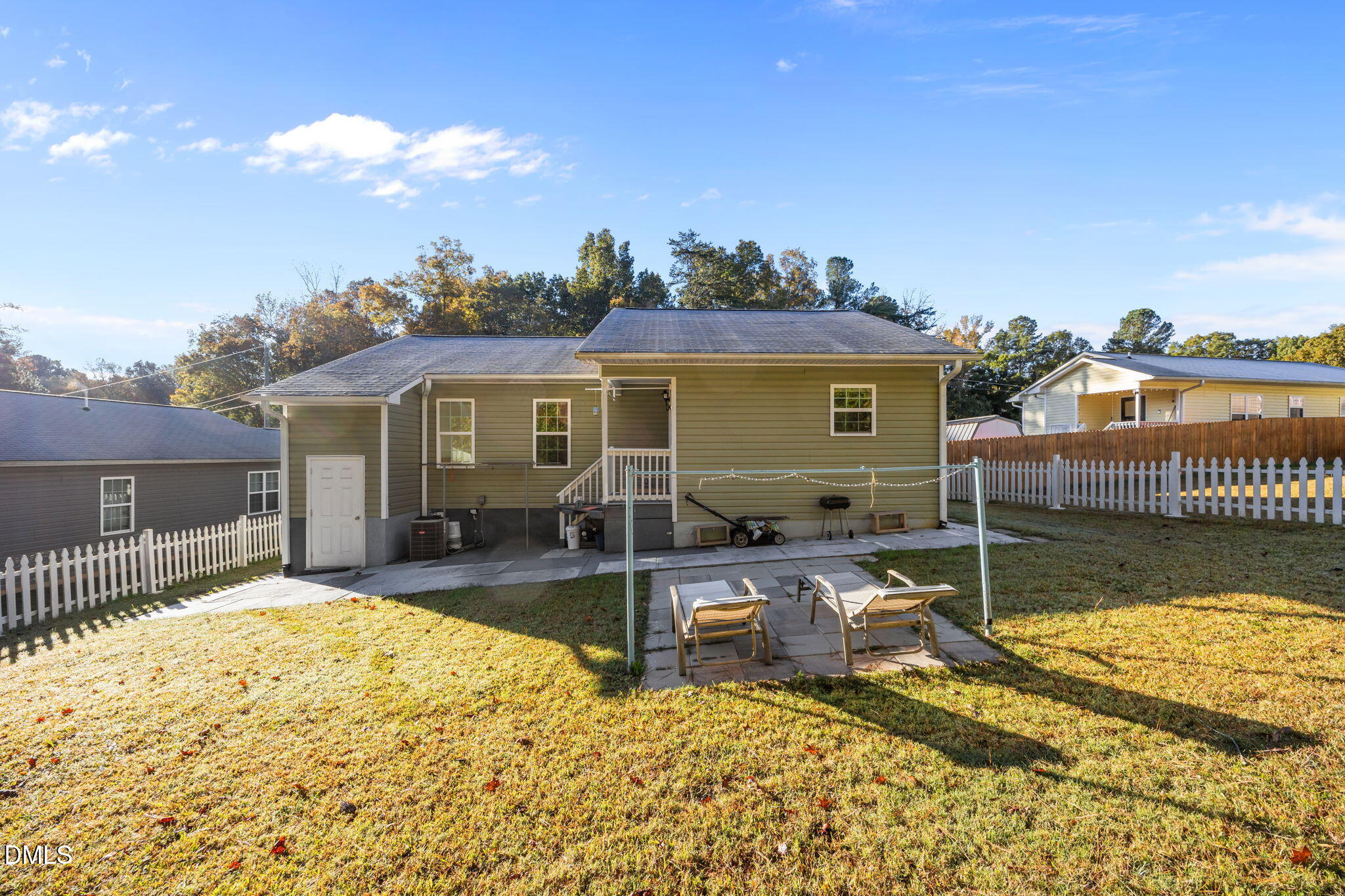 320 School House Road Efland, NC 27243 - Photo 11 of 18 front view of a house with a chairs and table in the patio