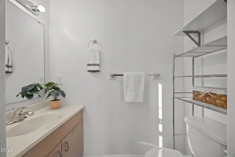 a bathroom with a sink and mirror