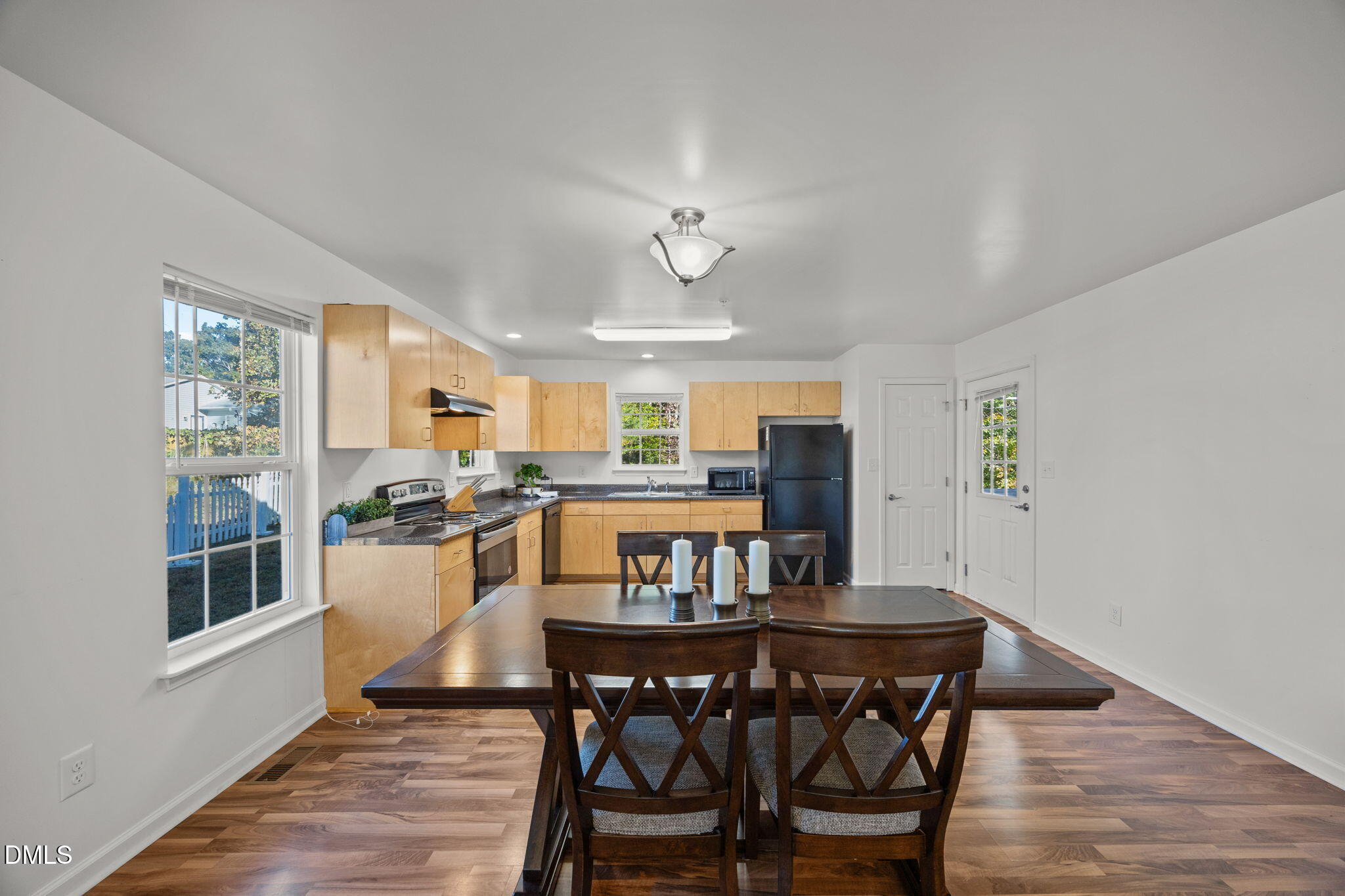 320 School House Road Efland, NC 27243 - Photo 3 of 18 a view of a dining room with furniture and a kitchen