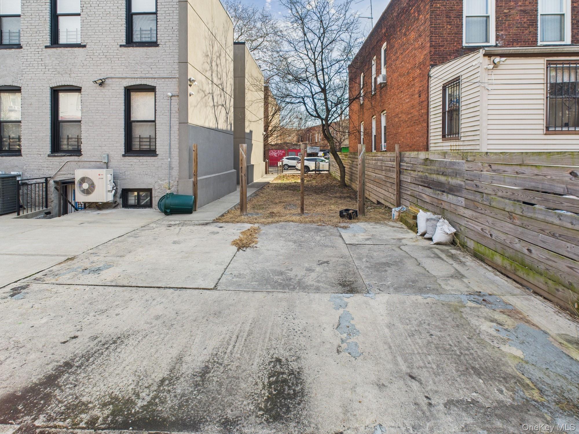 682 Hendrix Street Brooklyn, NY 11207 - Photo 3 of 6 a view of a brick house with many windows