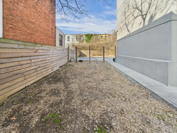 a view of a backyard of the house