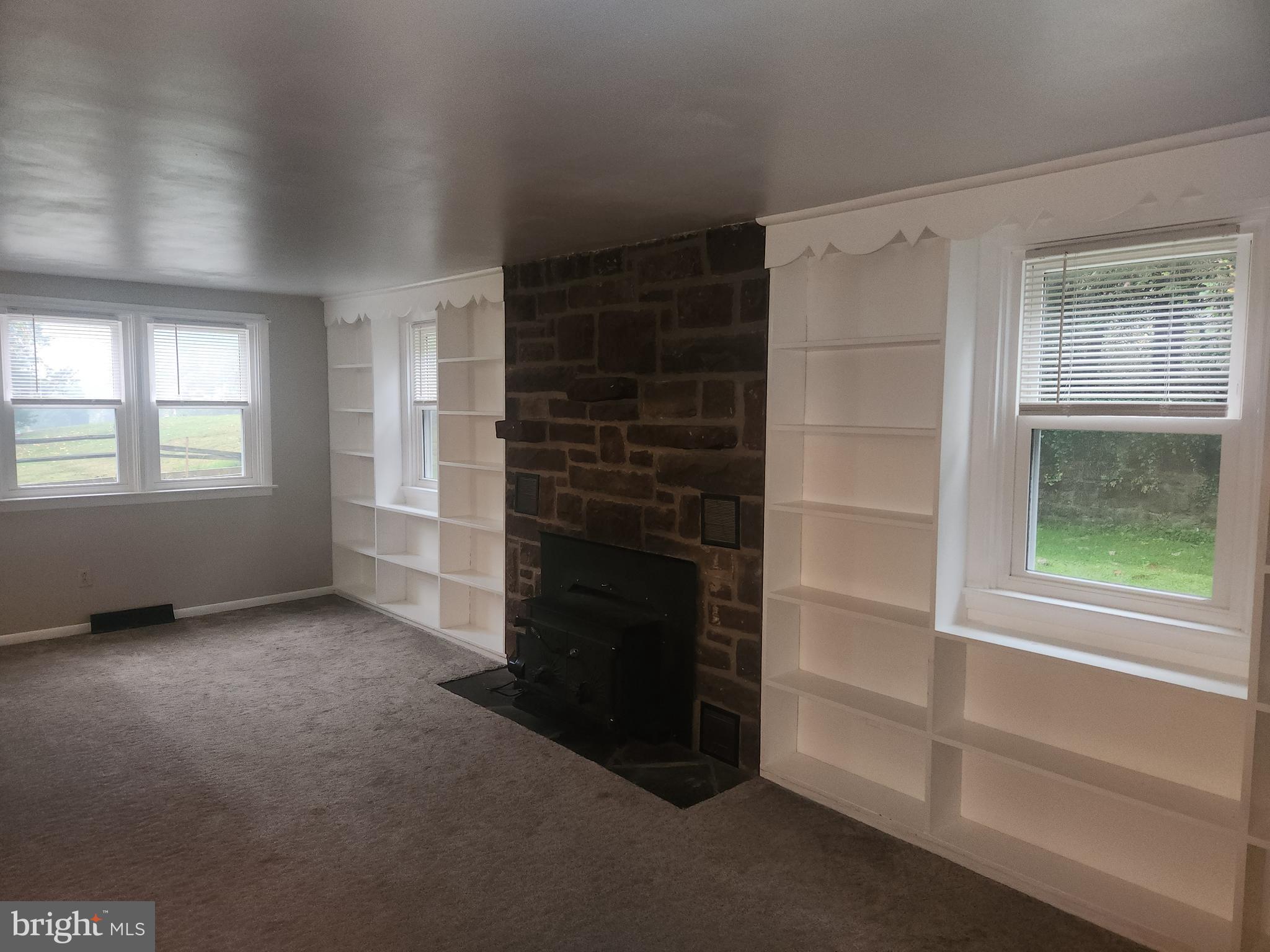 232 Mansion House Road Manheim, PA 17545 - Photo 55 of 107 an empty room with windows and fireplace