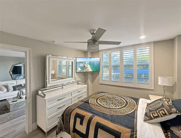 a view of a livingroom with furniture window and wooden floor