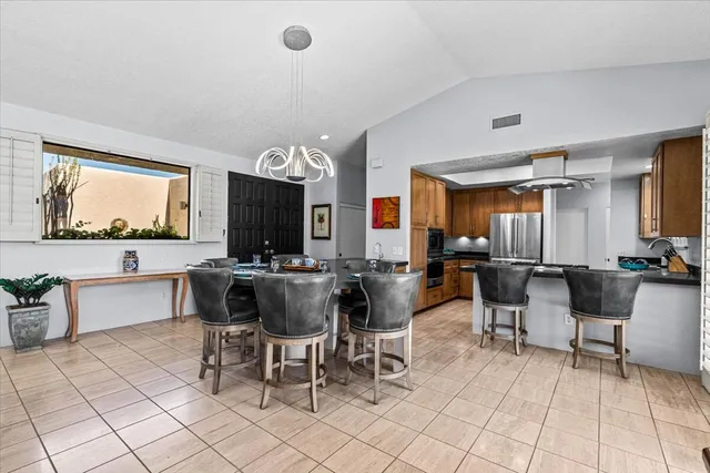 a kitchen with a stove a sink a counter top space and appliances