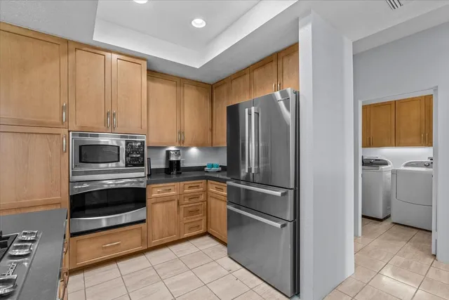 a bedroom with a bed and glass window
