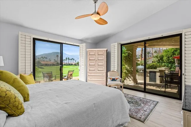 a view of a table and chairs in the garden