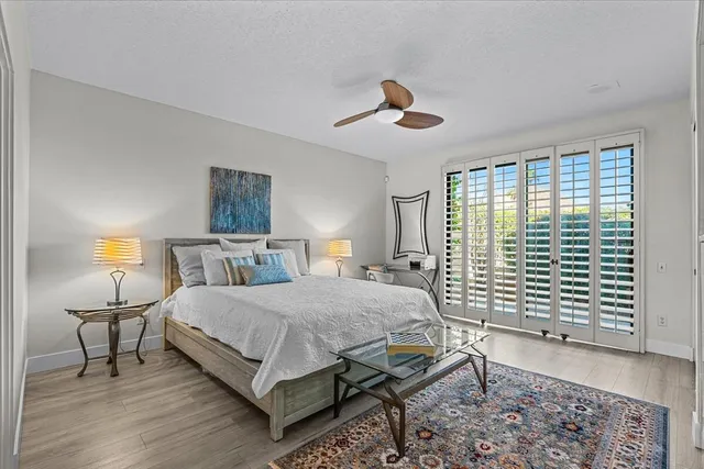 a bathroom with a tub a sink and mirror