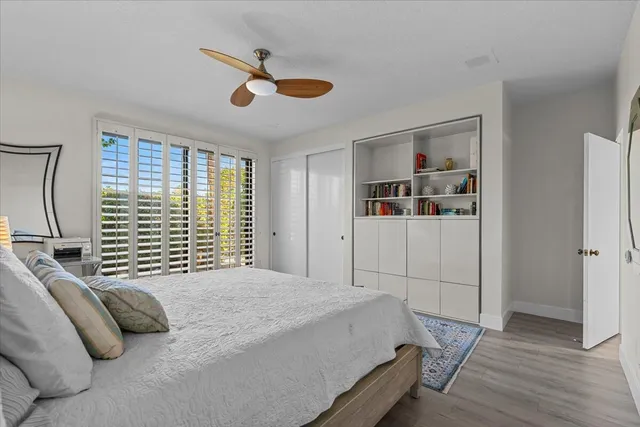 a backyard of a house with potted plants