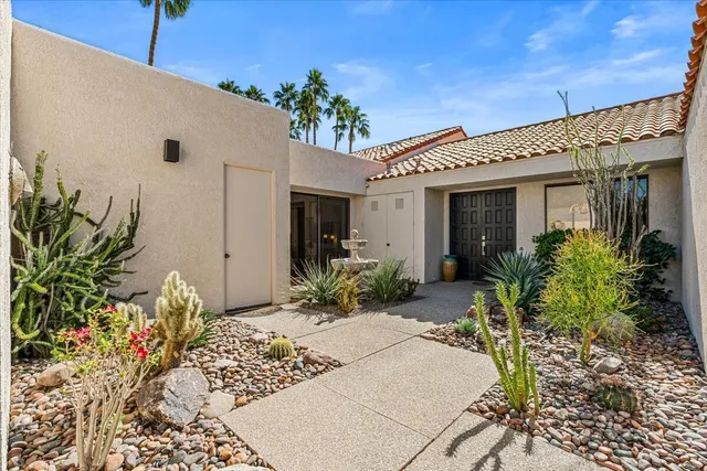 a potted plant sitting in front of a house