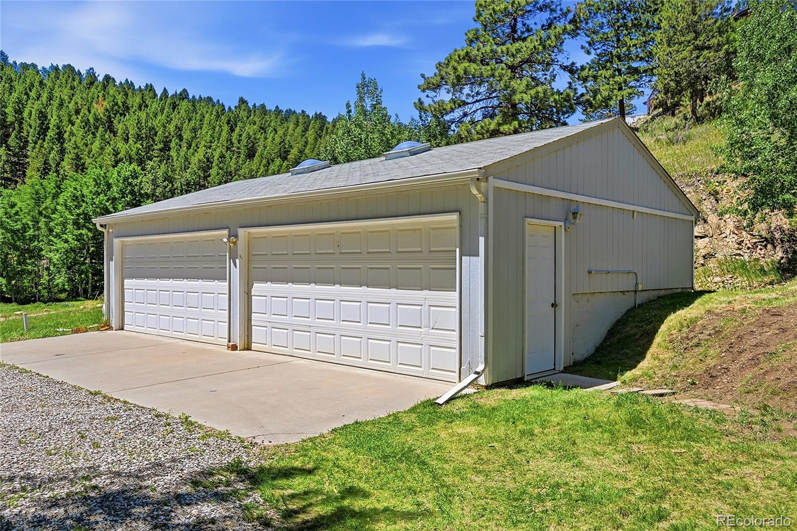 427 Brookside Drive Bailey, CO 80421 - Photo 10 of 37 a house with trees in the background