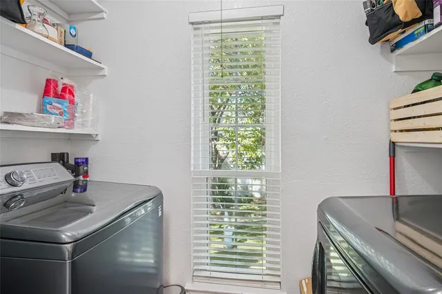 a bathroom with a sink a vanity and a window