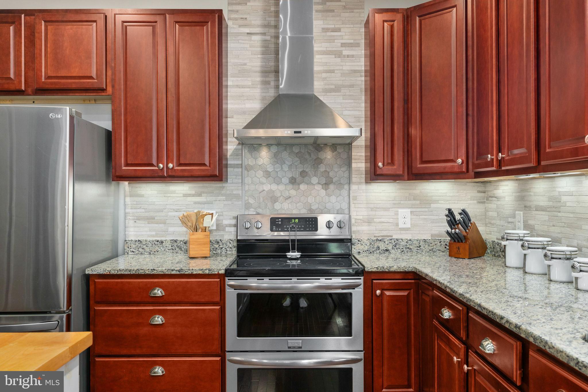 13026 Elk Run Road Bealeton, VA 22712 - Photo 21 of 54 Modern kitchen with rich wood cabinetry.