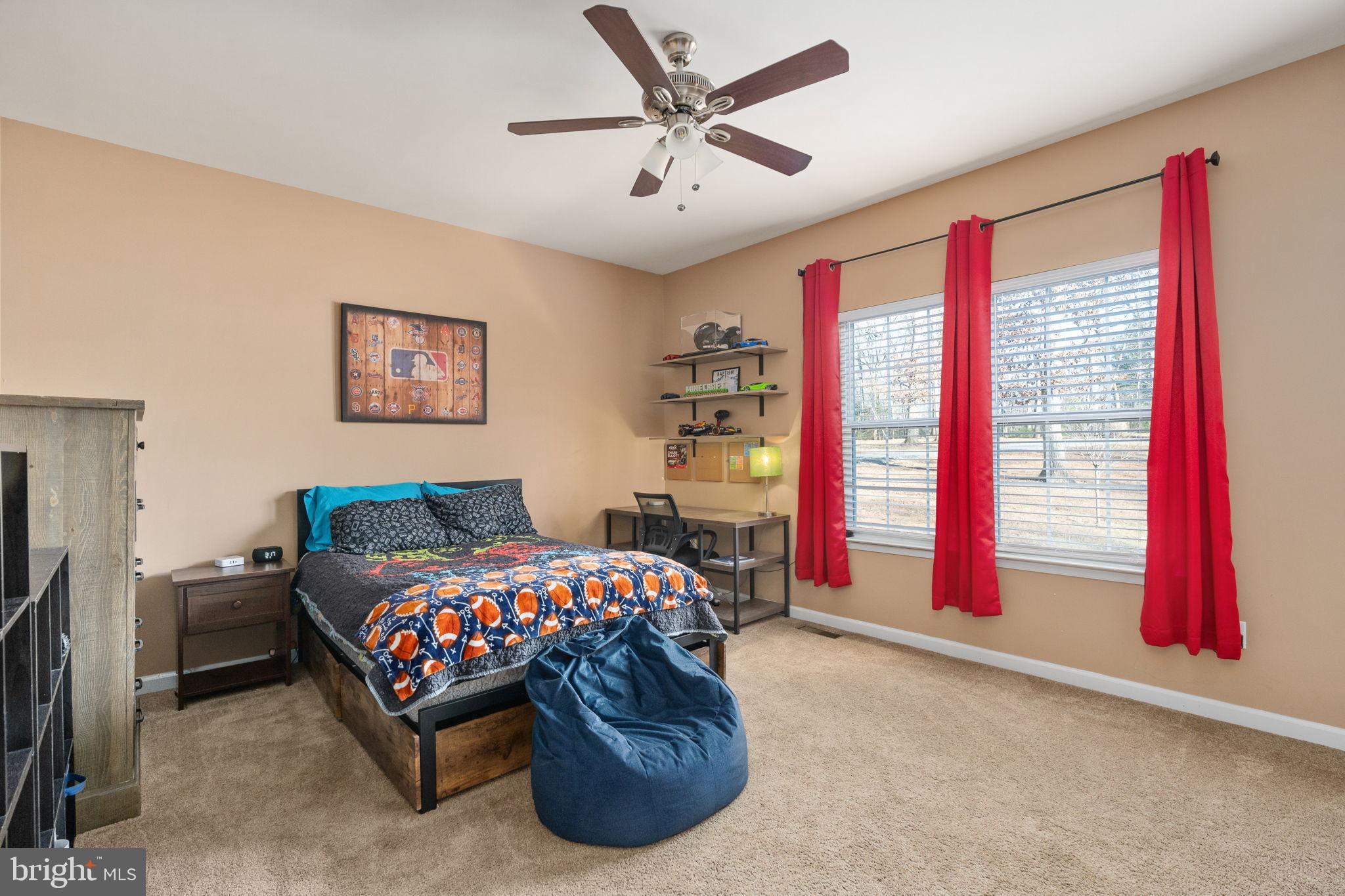 13026 Elk Run Road Bealeton, VA 22712 - Photo 23 of 54 Cozy bedroom with vibrant accents and light.