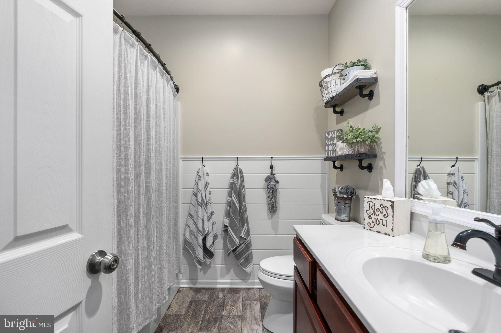 13026 Elk Run Road Bealeton, VA 22712 - Photo 28 of 54 Charming bathroom with modern touches.
