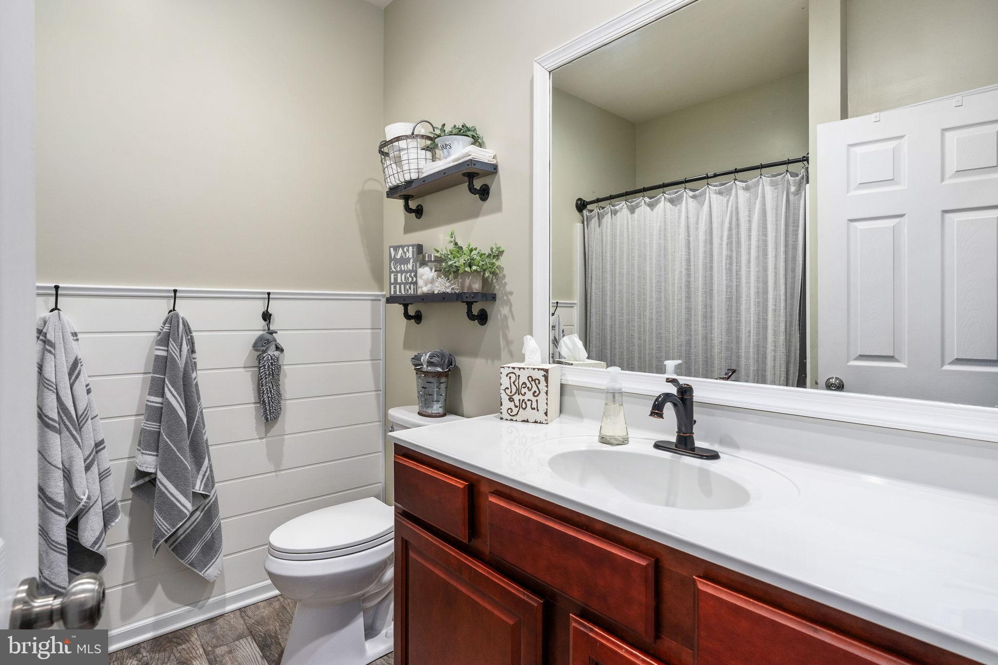13026 Elk Run Road Bealeton, VA 22712 - Photo 30 of 55 Charming bathroom with modern touches.