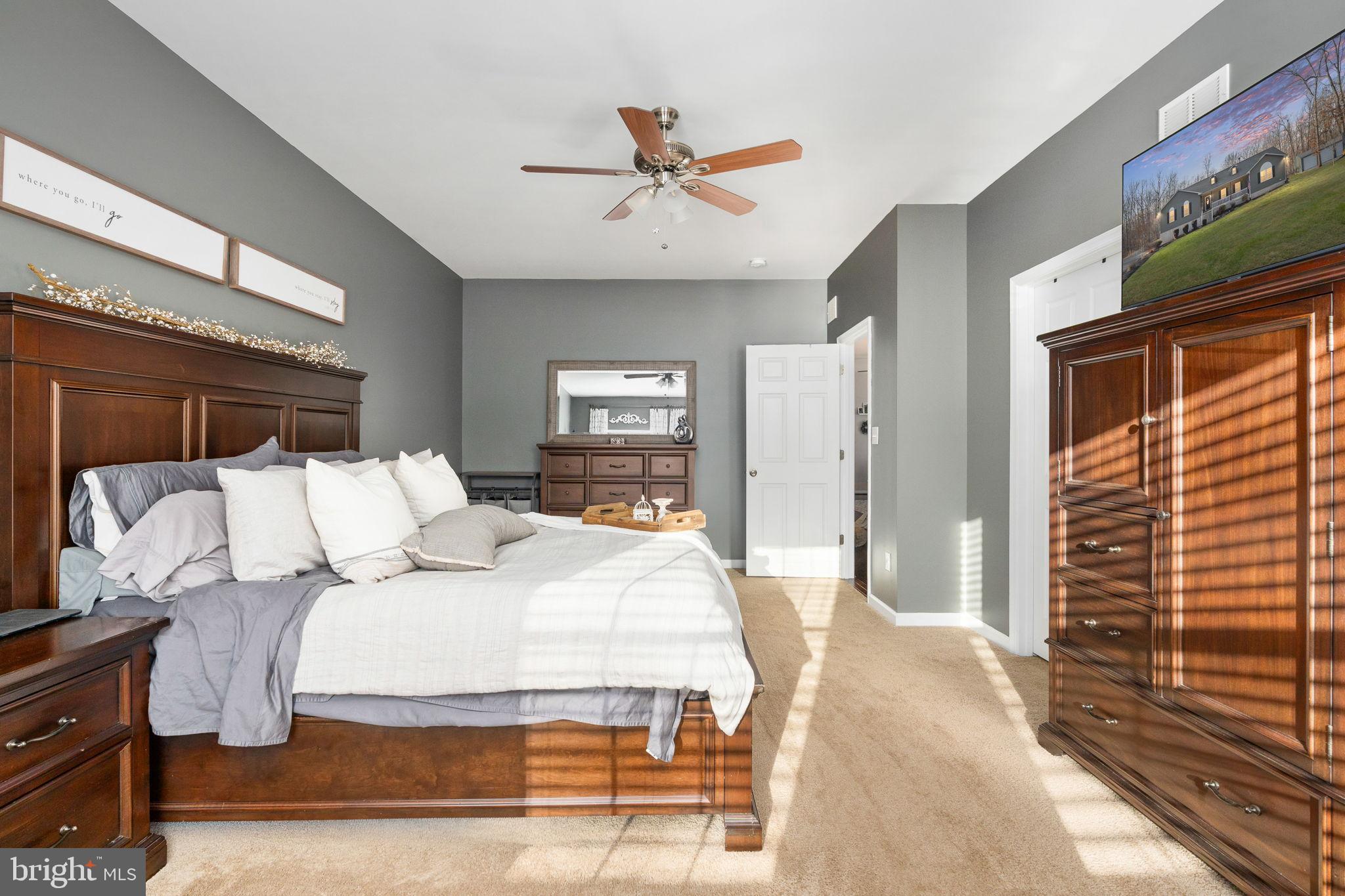13026 Elk Run Road Bealeton, VA 22712 - Photo 33 of 55 Serene bedroom with warm wooden accents.