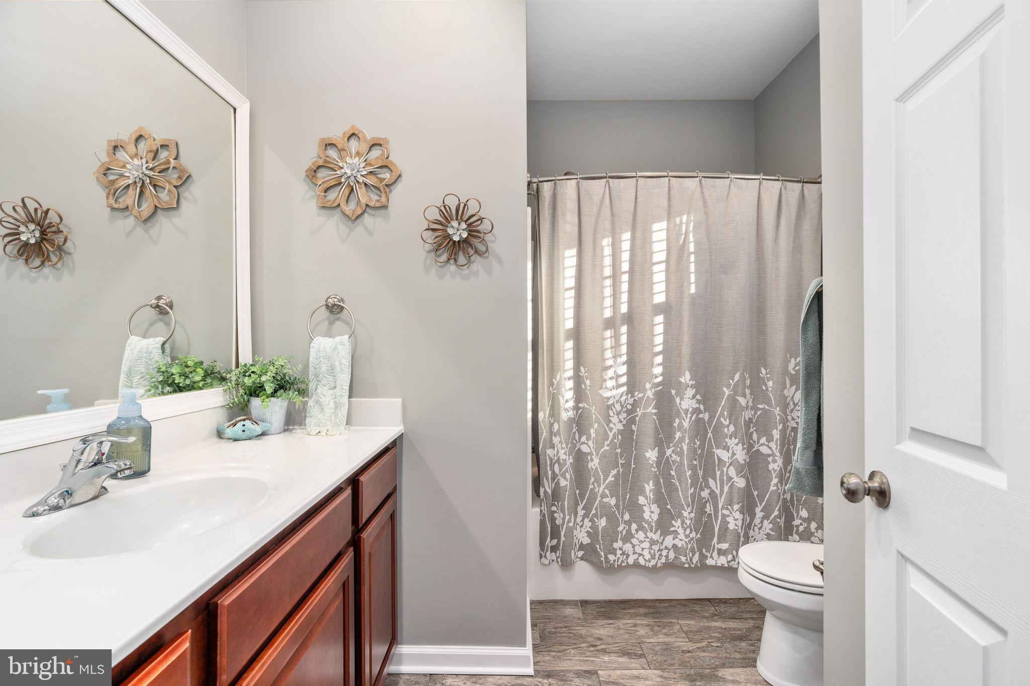 13026 Elk Run Road Bealeton, VA 22712 - Photo 34 of 54 Serene bathroom with elegant decor accents.