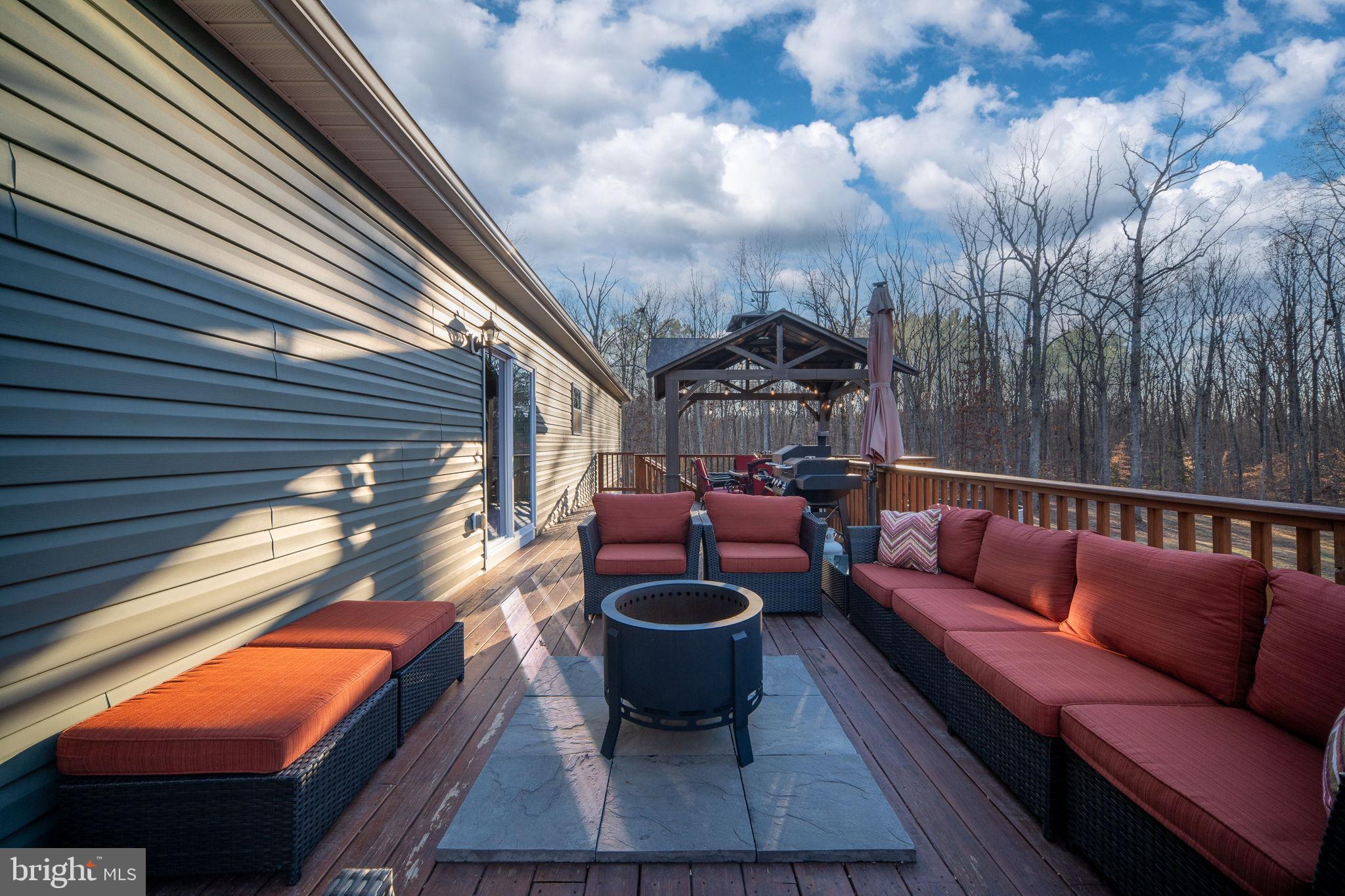 13026 Elk Run Road Bealeton, VA 22712 - Photo 52 of 55 Serene deck retreat with cozy seating.
