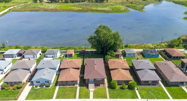 a view of a backyard with wooden fence